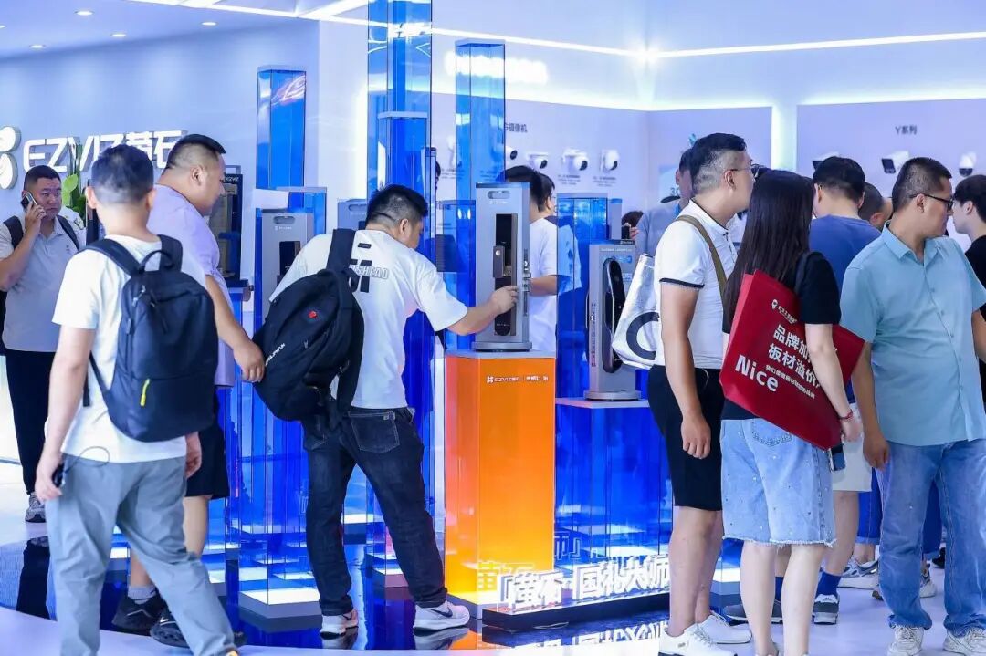 Delegates trying the smart locks at an EZVIZ exhibition station