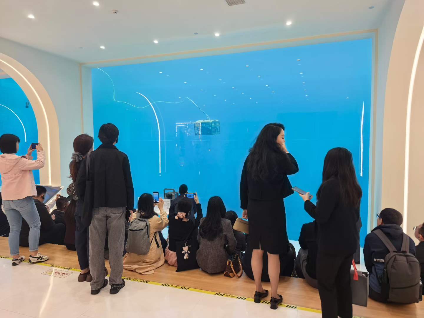 A demonstration installation in the ShenHao Robot exhibition hall showing robot systems in a simulated operating environment