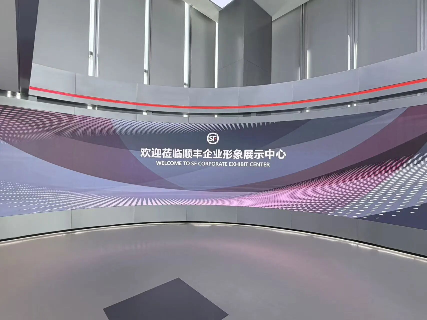 A briefing at the curved screen in the SF exhibition hall in Shenzhen