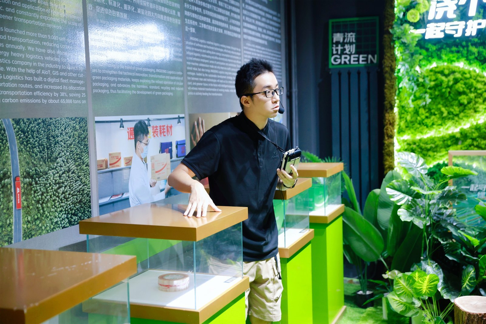 An exhibition panel on green logistics and fleet efficiency at Beijing Asia No.1