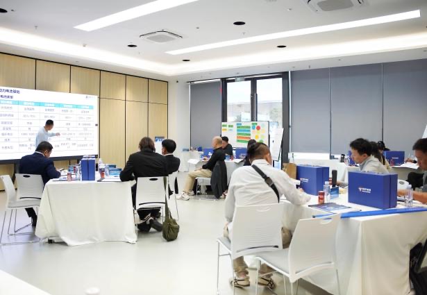 Thai technicians practicing high-voltage battery procedures in Shenzhen